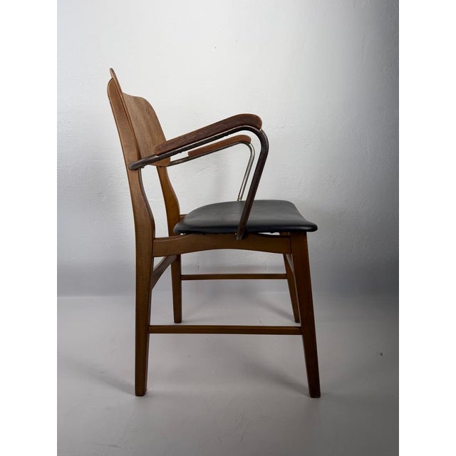 Original Danish armchair designed in 1954 by Steen Eiler Rasmussen and Kaj Lyngfeldt Larsen, manufactured by Danbork,...