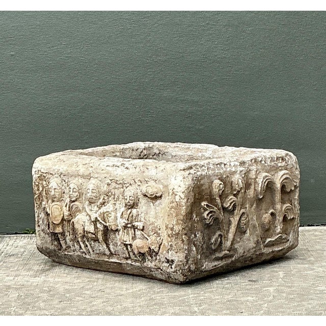This vintage figural planter presents a compelling blend of sculptural artistry and functional design, crafted with cement...