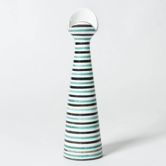 Cool faience vase by Stig Lindberg, in an asymmetrical, fun form. Graphic, hand-painted pattern of black and aquamarine...