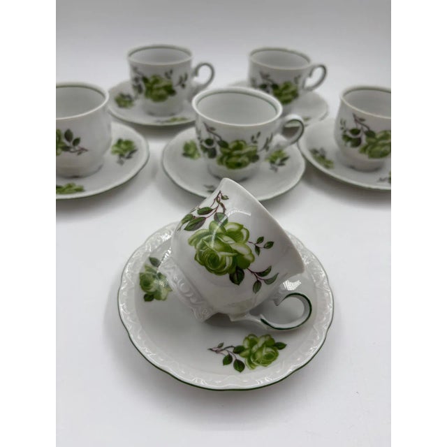 Item: Fine mocha/espresso set by Mitterteich Bavaria with six cups and six saucers; decorated with green roses and a...