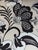Fun swiveling barrel-back club chair upholstered in bold black-and-ivory floral fabric. It features a wraparound back,...