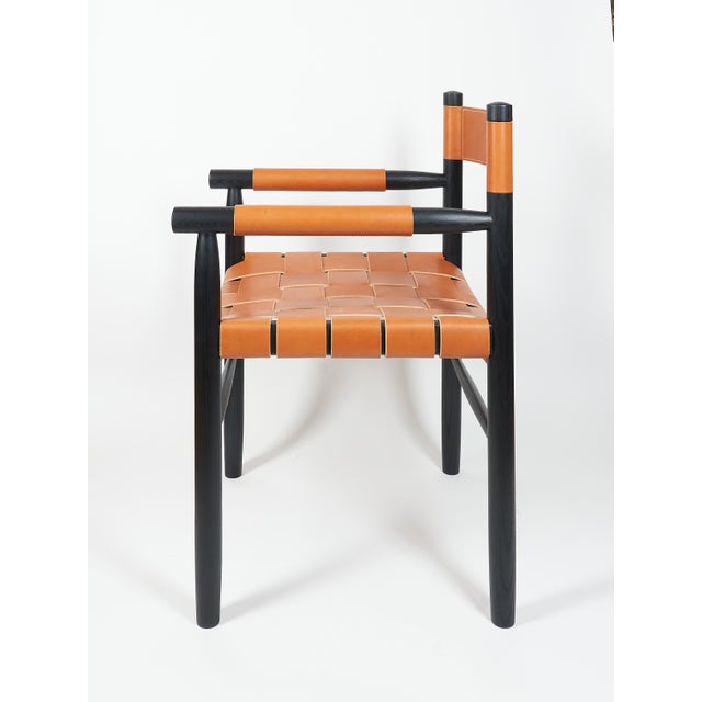 The Dining chair is made of ebonized ash with leather woven seat and a leather backrest, designed and built by Valeriy...