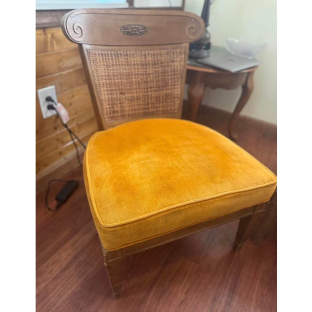 Stylish set of two vintage wide-seat mid century modern cane back accent chairs. Each chair features a solid carved wood...