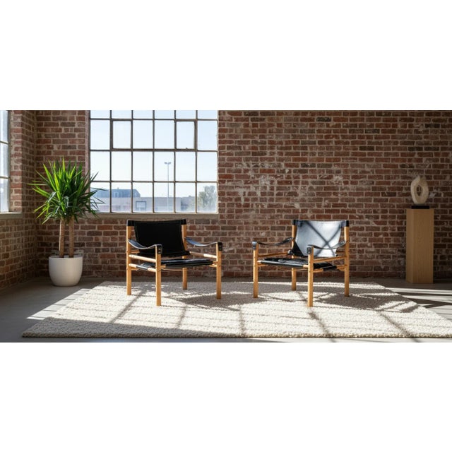 Exceptional pair of safari chairs designed by Arne Norell and produced by Arne Norell AB in Sweden during the 1960s....