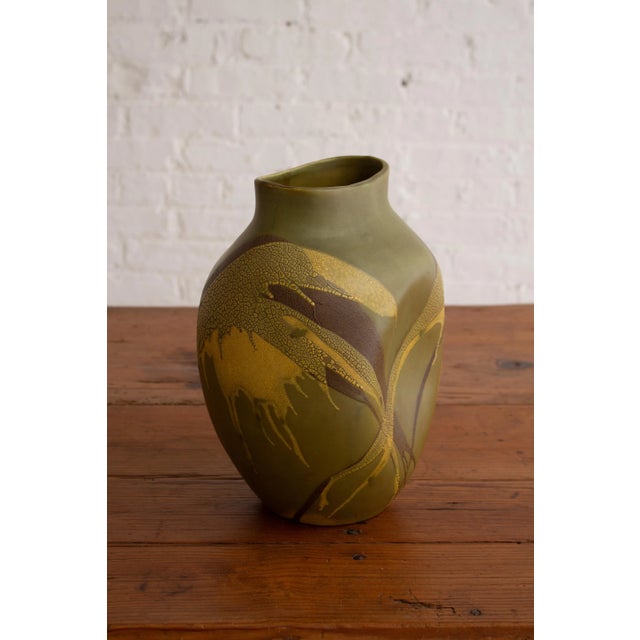 Royal Haeger organic free form vase from the "Earth Wrap" series. Green base coat with abstract textured yellow and brown...