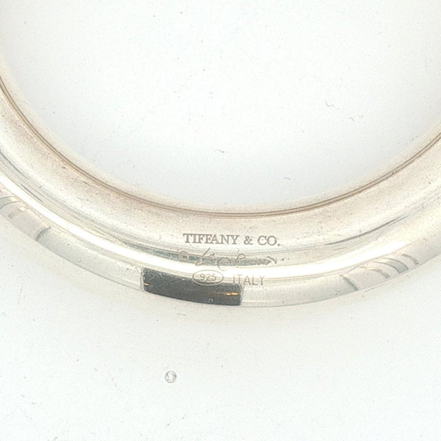 A sterling silver bangle bracelet by Elsa Peretti for Tiffany & Co. Crafted in Italy. The bracelet features a smooth,...