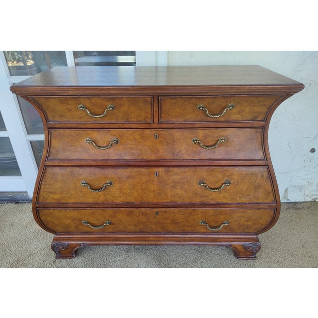 Townhouse Collection Bombe chest with burl wood drawer fronts. Model 30-9464. Restored and in excellent condition. 46ʺW ×...