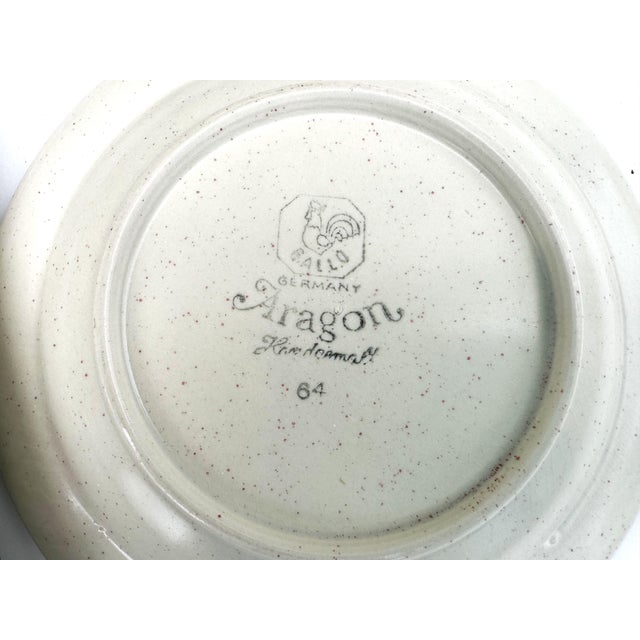 This charming vintage Aragon Handmalerei Germany pottery dinner service comprises 21 coordinated pieces decorated with...