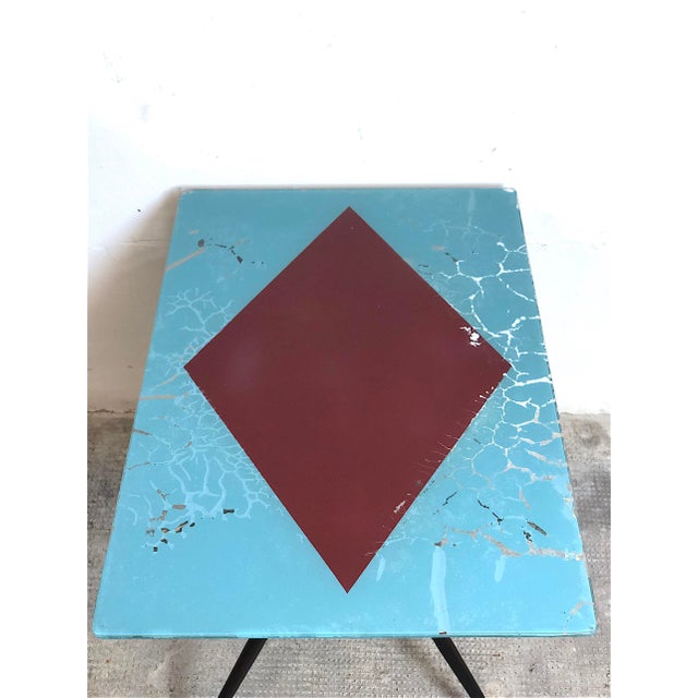 Glass coffee table with magazine rack, 1960s, Made in Italy. The table is made with a metal and brass frame, a silk-...