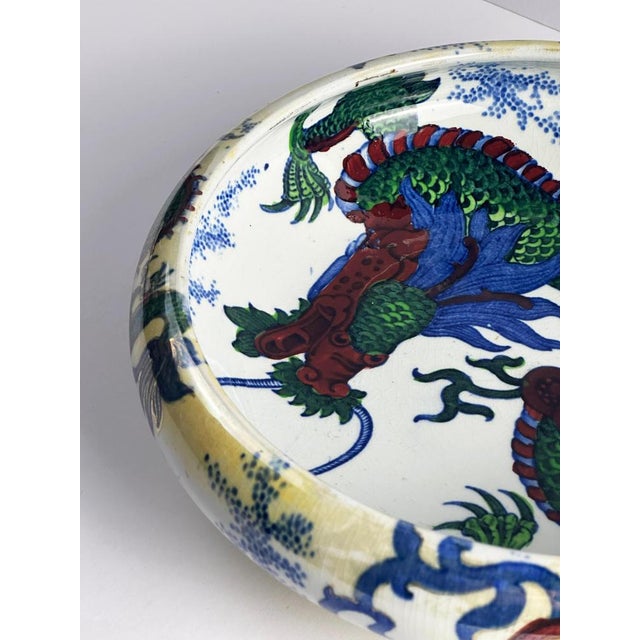 A hand-painted ceramic bowl designed by Frederick Rhead in the 1930s for Wood & Sons’ Bursley Ware line, this decorative...