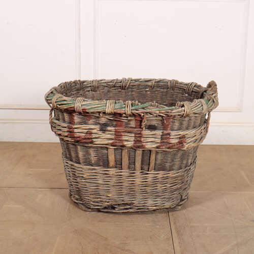 Early 20th Century French wicker champagne grape basket. Would make a wonderful log basket due to it's heavy quality....