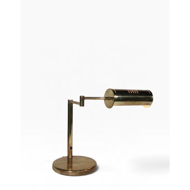 Chic mid century brass flex arm desk lamp, in good, original, clean, working, and ready to use condition. The lamp...