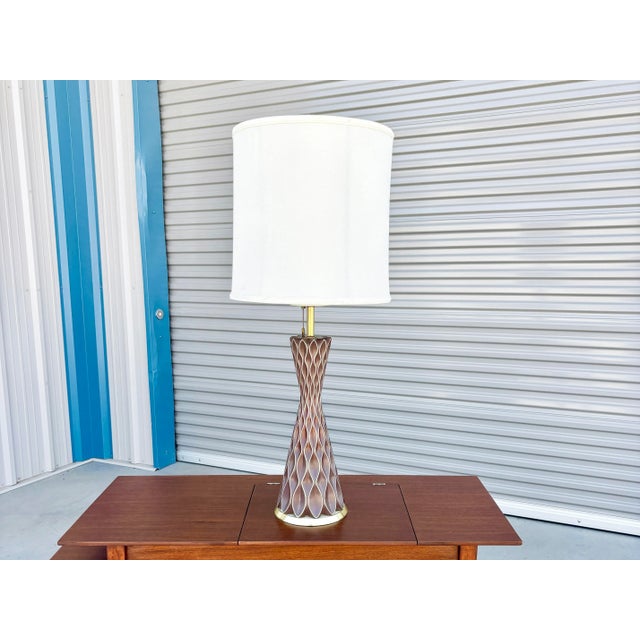 An exquisite statement piece of mid-century lighting design, this vintage table lamp was designed by Gerald Thurston for...