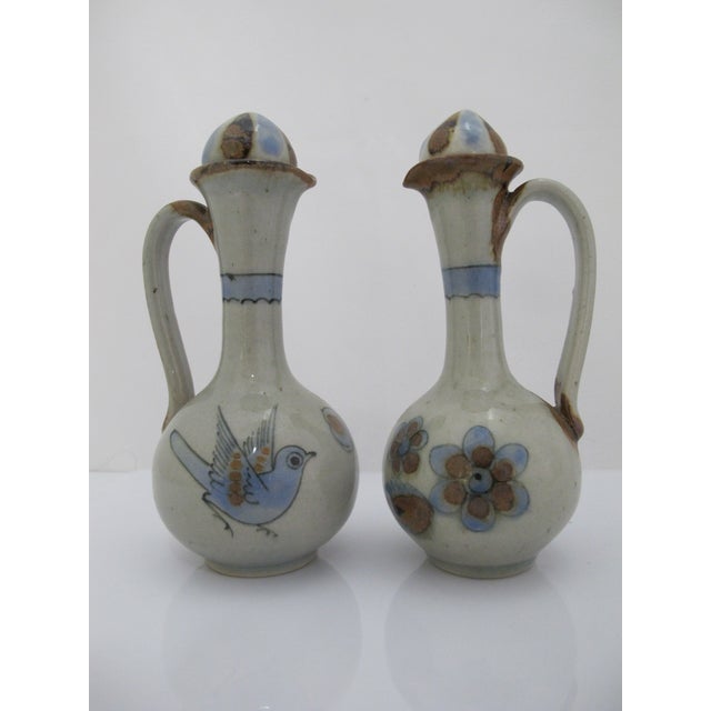 Ken Edwards Mexican stoneware pottery stoneware oil and vinegar cruets with lids from the El Palomar studio in Tonalá,...