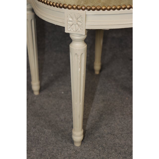 This exceptional set of eight French Louis XVI chairs by Maison Jansen represents the pinnacle of Parisian decorative arts...