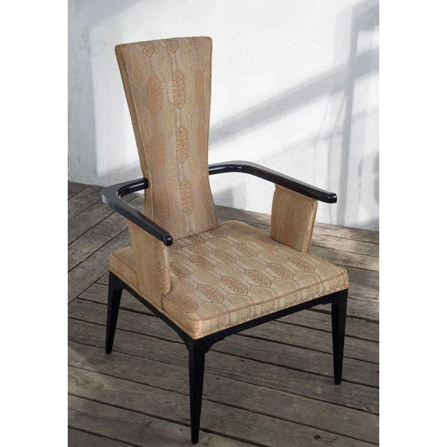 A very unique pair of Hollywood Regency style American 1950's ebonized armchairs in vintage fabric. Make your living room...