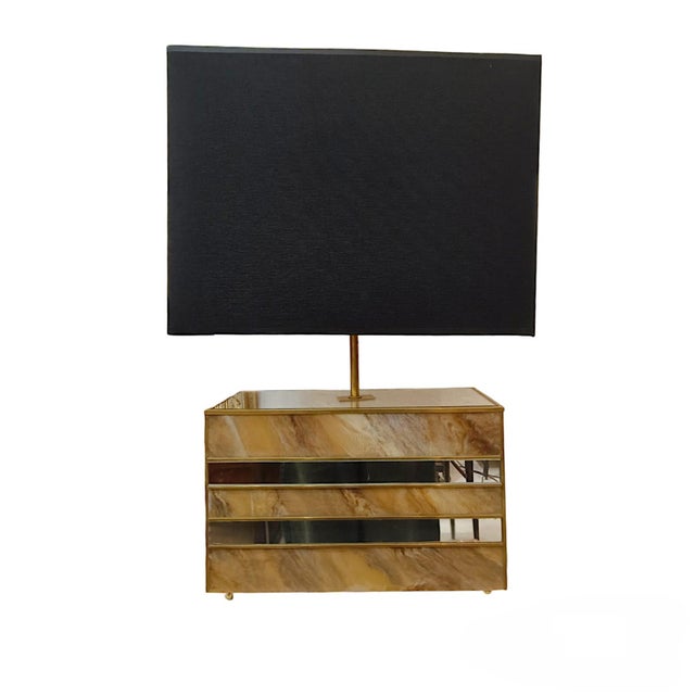 Pair of Italian-designed 1980s table lamps with marble-effect glass. Their square structure has a wooden core covered with...