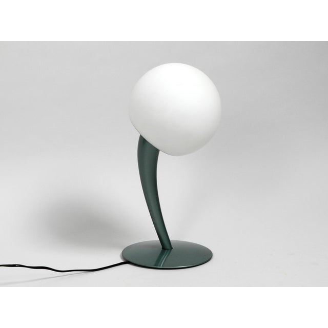 Great extraordinary table lamp from the 80s or 90s. Rare minimalist design. The lamp neck tends to the side, what gives...