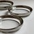 Mid-Century Modern Vintage Dorothy Thorpe-Style Clear Glass Coasters With Silver-Toned Metal Rims – Set of Five For Sale - Image 3 of 13