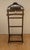 Elegant vintage valet stand, crafted in wood with a clean and practical design. This functional piece features an...