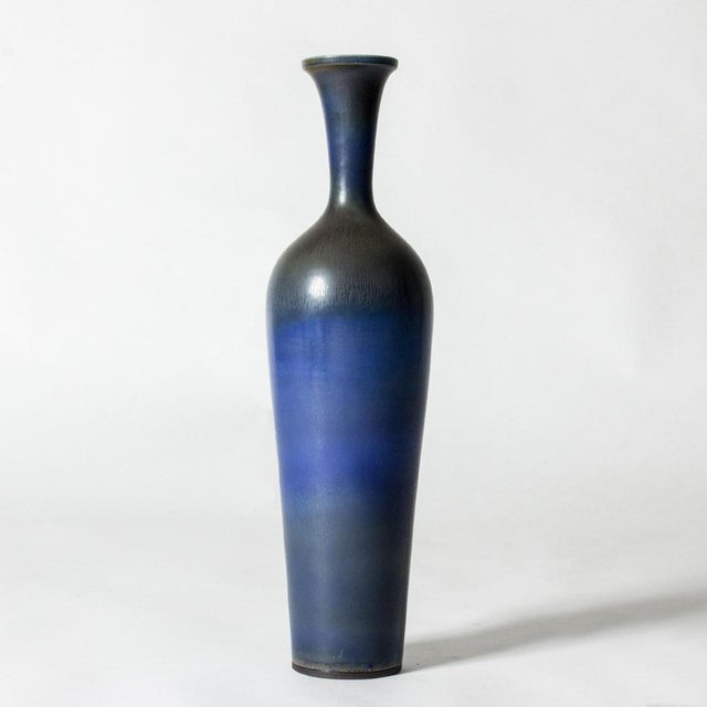 Stunning, oversized stoneware vase by Berndt Friberg in an elegant form with beautiful dark blue hare’s fur glaze. Rare...