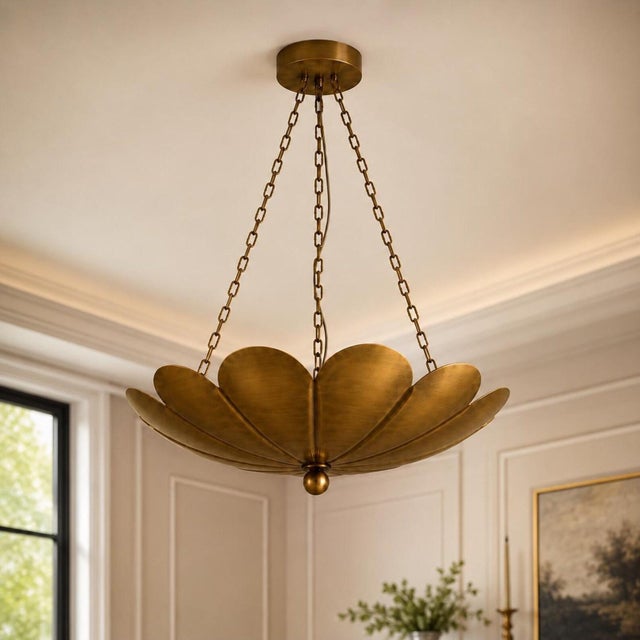 Inspired by the graceful form of a blooming lotus, this handcrafted solid brass pendant chandelier features layered petal-...