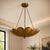Inspired by the graceful form of a blooming lotus, this handcrafted solid brass pendant chandelier features layered petal-...