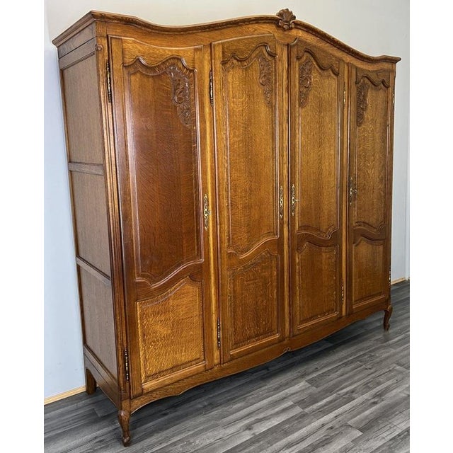This elegant Vintage French Louis style wardrobe showcases beautifully shaped doors, refined carved detailing and a warm...