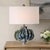 This Table Lamp Features A Distinctive, Organically Shaped Ceramic Base, Covered In A Nuanced Glaze In Hues Of Blue,...