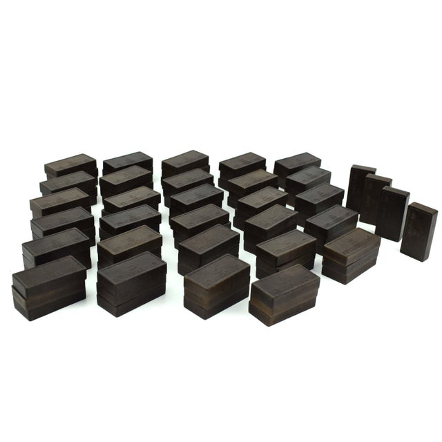 Step back into the nostalgia of the 1940s with these vintage Halsam double-12 wooden dominoes, each piece intricately...