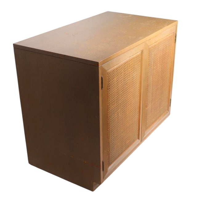 Chic two door storage cabinet by the Grand Rapids Chair Co. as part of the Sligh Furnitre Cross Country series designed by...