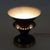 A table lamp in an interesting brown color with gold details, it will be a wonderful addition to the table or shelf....