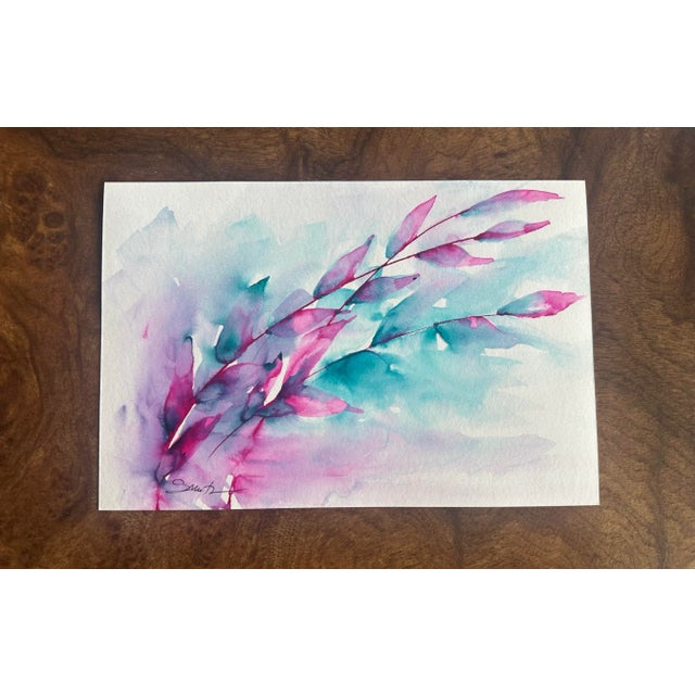 An expressive piece where turquoise and fuchsia collide in watery blooms and sweeping branches — dramatic wet-on-wet color...