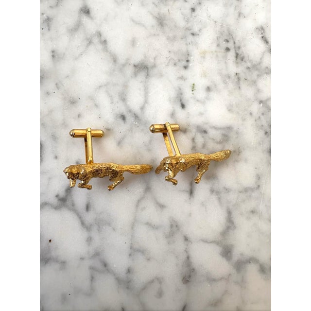 Handsome pair of vintage gold tone Fox cufflinks depicting each fox mid run. Size Large.
