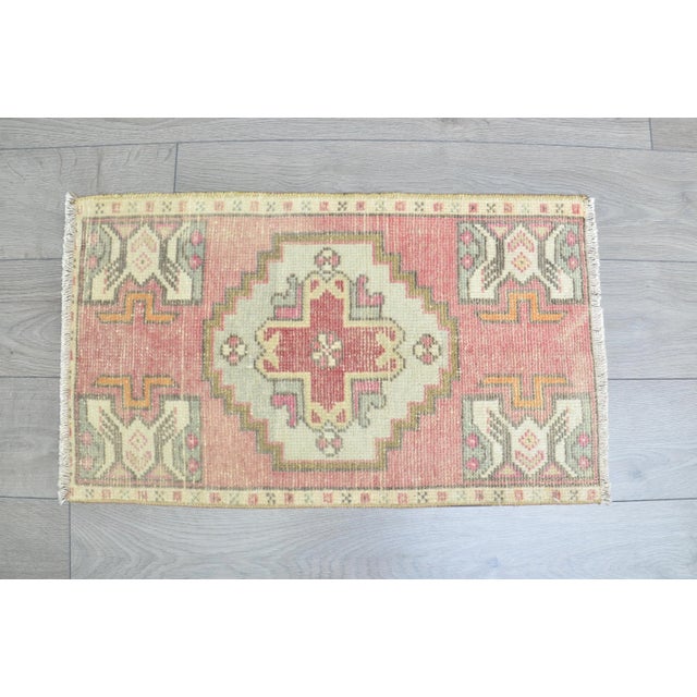This is a vintage Turkish Oushak rug from the 1960s. The piece was hand-knotted.