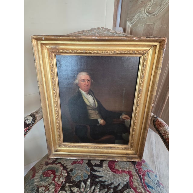 Late 18th Century portrait of a man that is seated and holding a letter.