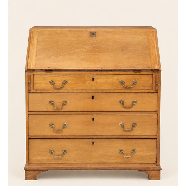 A handsome late 18th-century English Georgian slant-front bureau crafted in pine, retaining a wonderfully warm, mellow...