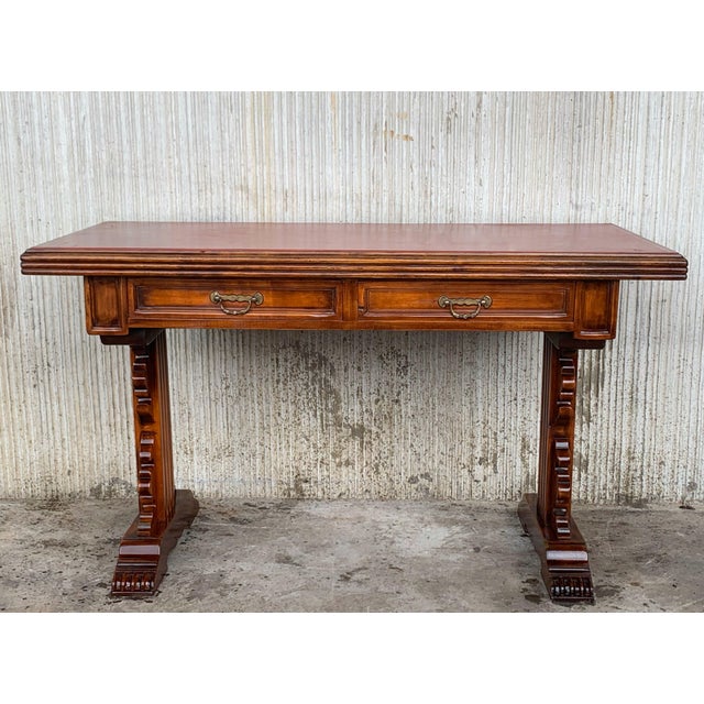 Spanish colonial desk or console table with two drawers signed by Valentí This piece has a two-pedestal legs with an...