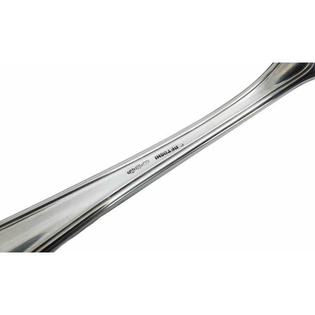 Elegant pair of Italian silver serving utensils comprising a cake server and matching serving spoon in a refined...