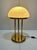 Elegant, large German table or floor lamp from the 1970s with a heavy brass body and a large opal glass dome. The dome...