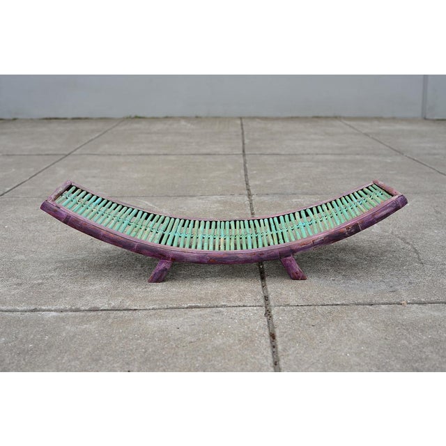 A unique and rare handmade vintage bamboo magazine rack painted in mint green and purple. It's rustic, hobo and modern all...