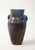 A ceramic jug with handles in a stunning glaze of aubergine and blue produced by Accolay Pottery. Founded in the 1950s in...