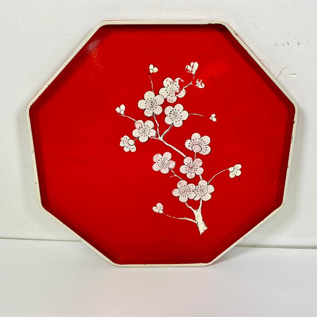 We love this octagonal shaped serving tray from the Mid-Century. Its vibrant red color is fun and it features a white...