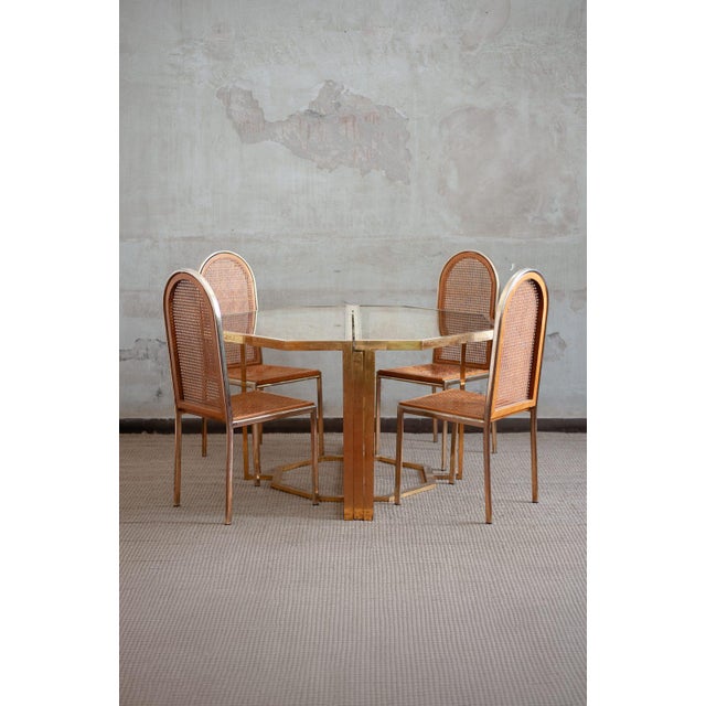 Glass and brass dining set – 1970s set comprising an extendable table with brass structure and smoked glass top, together...