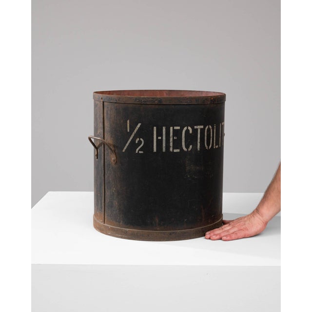 Discover a piece of history with this authentic Early 20th Century Metal Measure, a testament to the storied past of...
