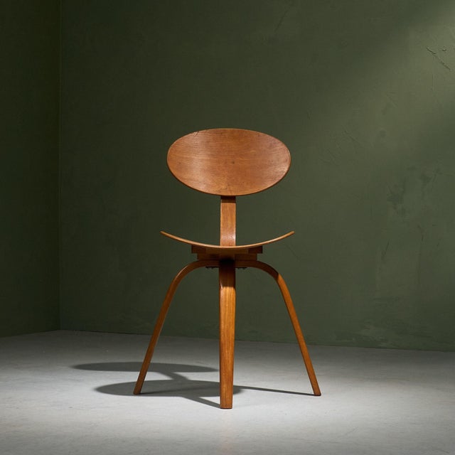 This 'bow wood no 03' side chair, designed in the late 1940s/early 1950's, features a distinctive plywood construction...