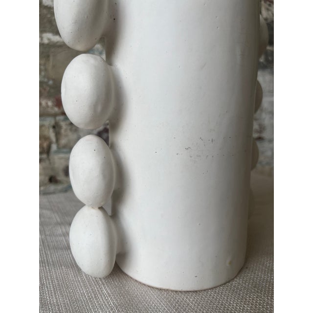 Elevate your space with this stunning handcrafted ceramic vase, featuring a bold and contemporary design. The cylindrical...