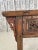 A late 19th-century Chinese Altar table. This Altar table features a deeply carved drawer front with the original metal...