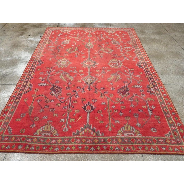 Wool symmetric knots on a wool foundation. The classic “Turkey red” field features a spacious design of straight diagonal...