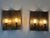 Set of two large, rare and highly decorative mid-century modern sconces or wall fixtures. Designed and manufactured in...